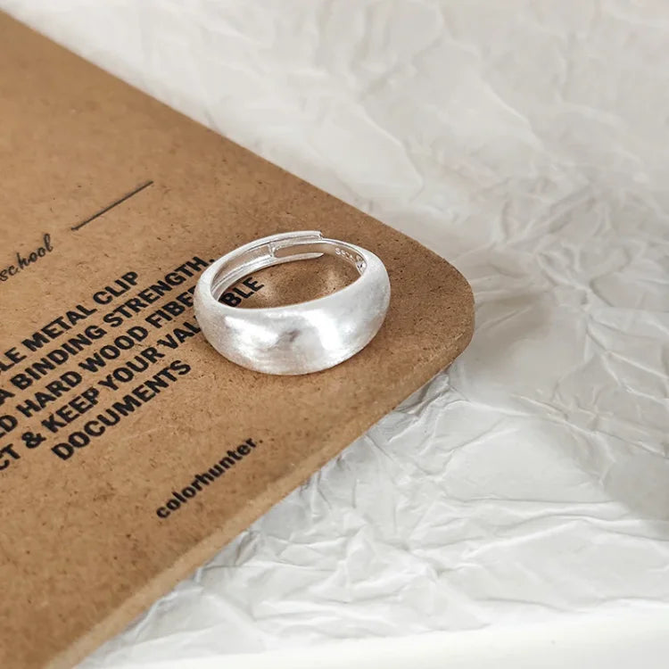 Stylish women's adjustable silver dome ring with a modern brushed finish. Pure silver, perfect for any outfit.