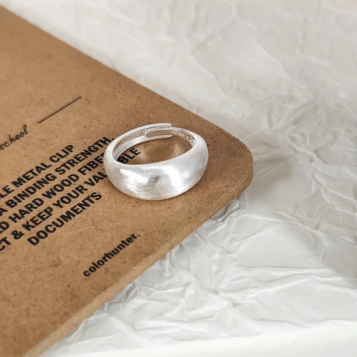 Stylish women's adjustable silver dome ring with a modern brushed finish. Pure silver, perfect for any outfit.