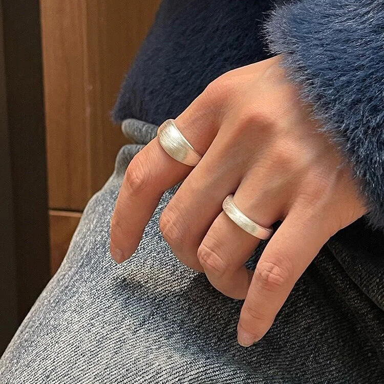 Versatile pure silver dome ring with an adjustable band and elegant brushed finish. A must-have women's ring.