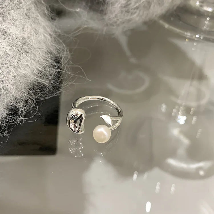 Stylish silver adjustable pearl ring for women, a beautiful fashion accessory with a unique pearl tree motif.