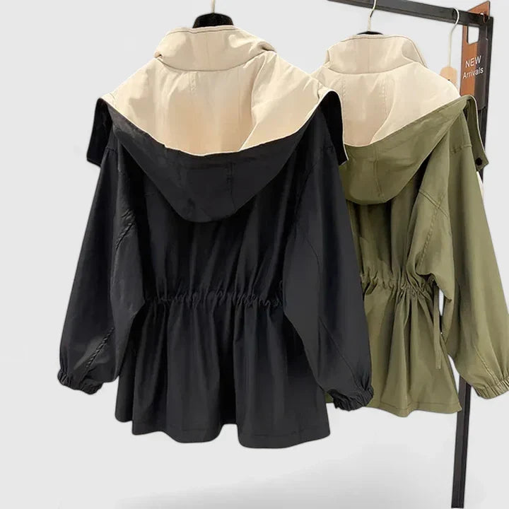 View of a woman wearing a chic, lightweight all-weather jacket, ideal for elegant everyday style.