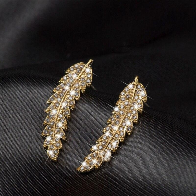Luxurious sterling silver gold plated angel wing dangle earrings, women's elegant fashion.