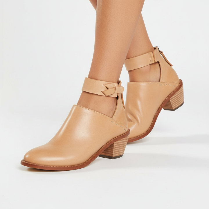 Chic women's mid-heel ankle boots in black vegan leather, comfortable and stylish for everyday wear