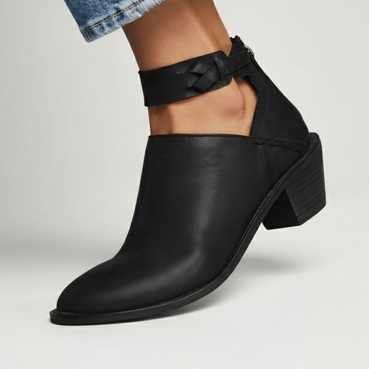 Black vegan leather women's ankle boots with a comfortable mid block heel, suitable for daily wear