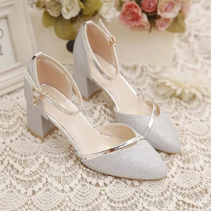 Comfortable women's block heel pumps with secure ankle strap, versatile dress shoes for any occasion.