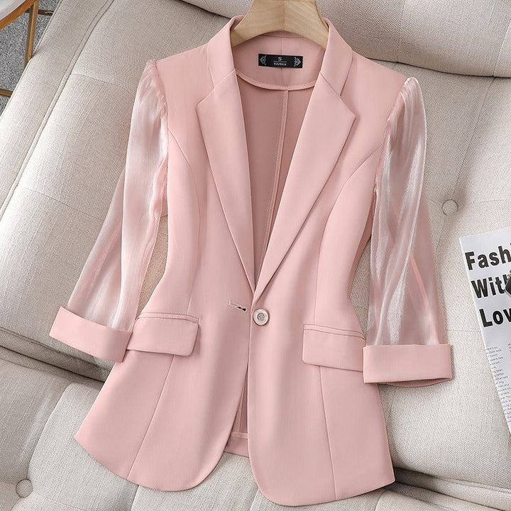 Modern pink women's Aria tailored blazer, featuring stylish sheer sleeves for a chic statement piece.
