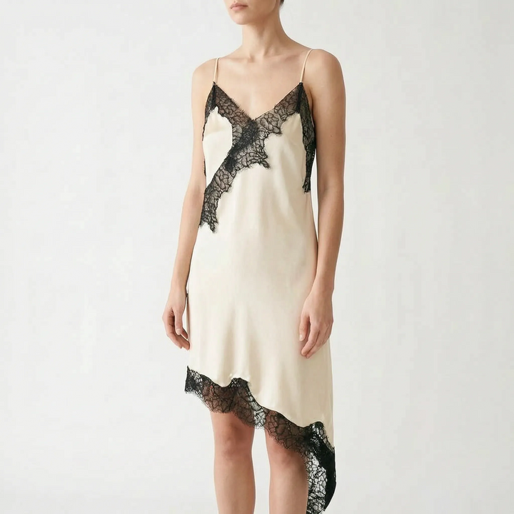 Sleeveless women's slip dress. Elegant V-neck design with beautiful lace trim & a flowing asymmetric hem. Evening look.
