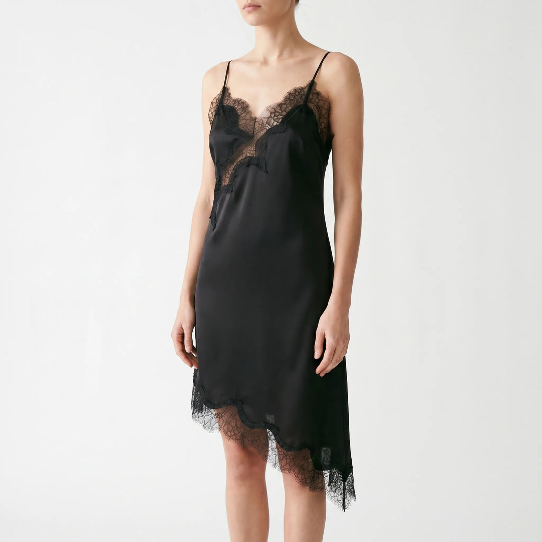 Lightweight women's summer slip dress for evening. Elegant V-neck, lace detail, and an eye-catching asymmetric hem.