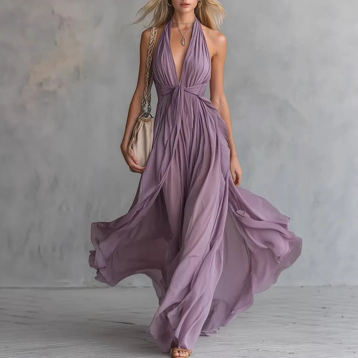 Elegant women's backless halter maxi dress with pleated side slit, perfect for evening parties & summer vacations.