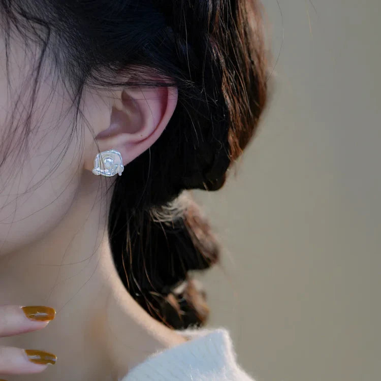 Elegant women's baroque pearl drop earrings, handcrafted with unique natural pearls and sterling silver hooks.