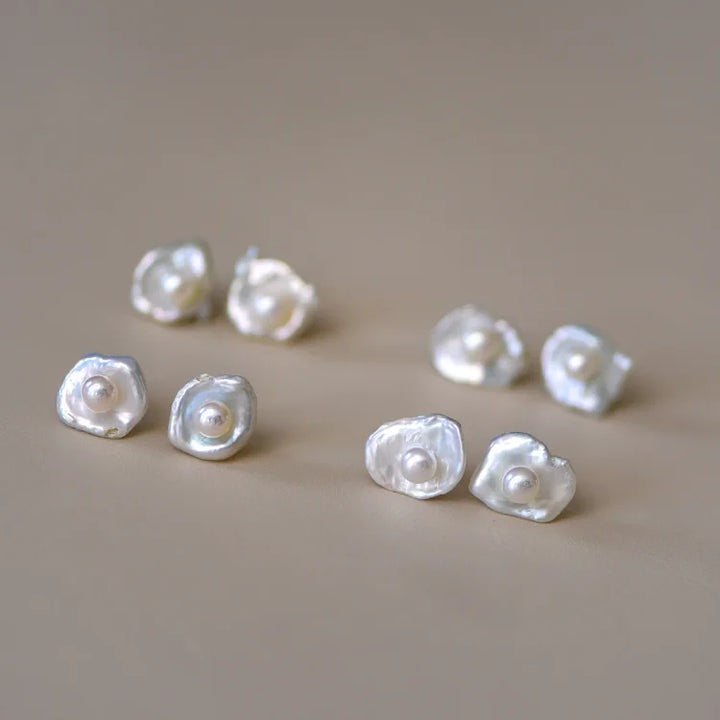 Timeless baroque pearl drop earrings for women, featuring irregular freshwater pearls on minimalist sterling silver.