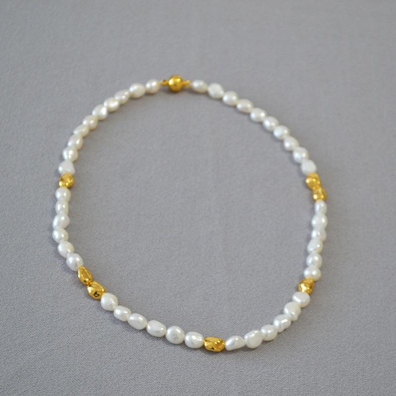Handmade women's baroque pearl necklace, a unique elegant statement piece with geometric gold accents for fashion.