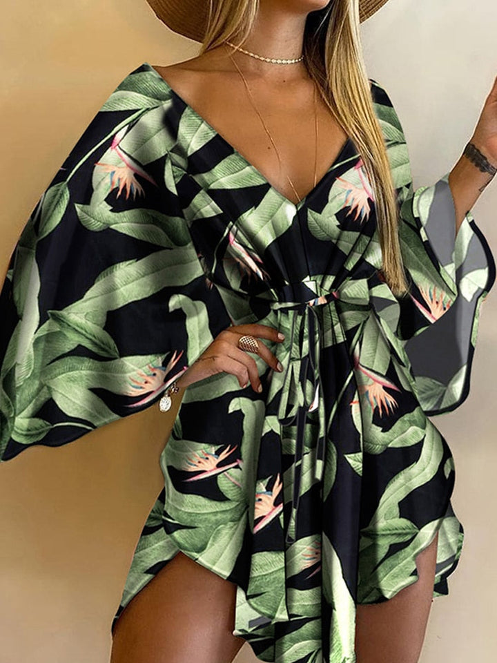 Fashionable women's loose fit mini dress with batwing sleeves & belt. Perfect V-neck casual summer short dress.