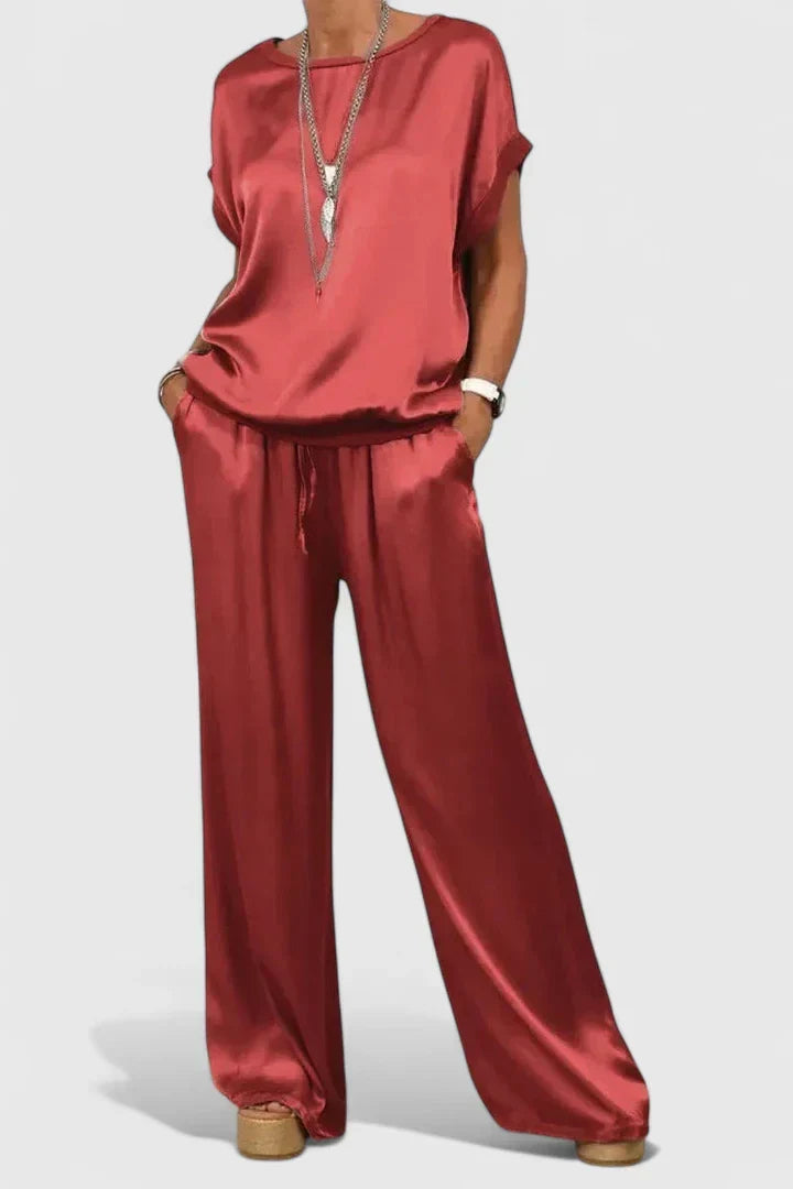 Stylish women's batwing top paired with elegant wide-leg trousers, creating a chic and comfortable two-piece set.