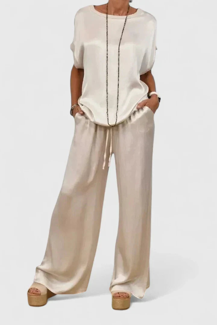 Women's casual elegant batwing top and wide leg trouser matching set, a comfortable and chic two-piece outfit.