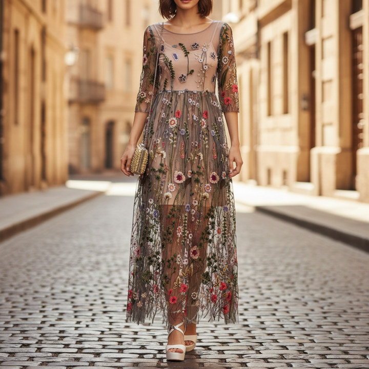 Elegant women's beige maxi dress with delicate floral embroidery, round neck & three-quarter sleeves for formal occasions.