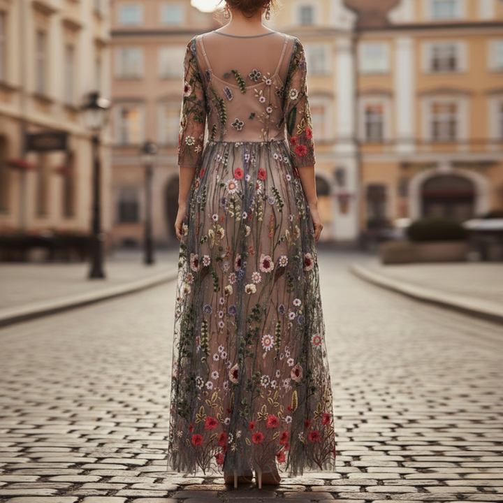 Black embroidered maxi dress for women, featuring elegant floral designs & three-quarter sleeves. Perfect for evenings.