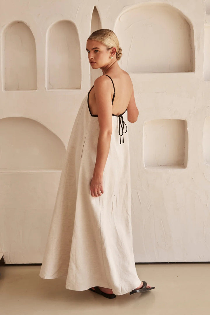 Trendy women's beige summer dress, an effortless midi style for party, vacation, or everyday chic. Flowy design.