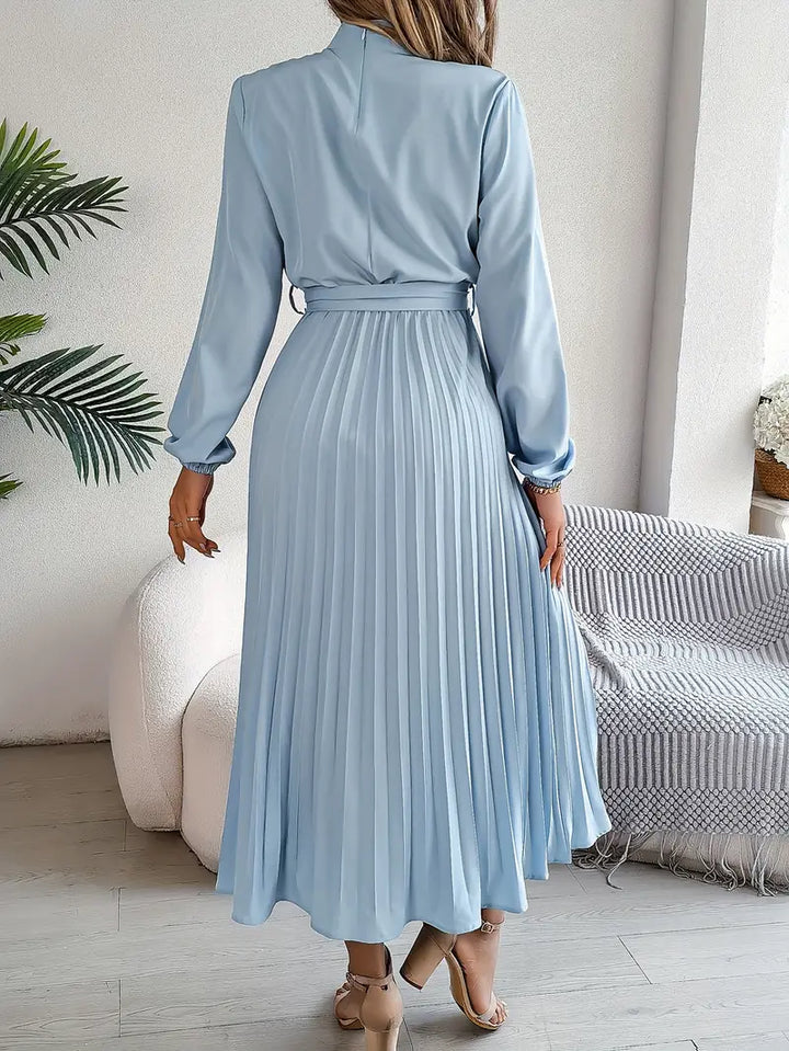 Long-sleeve women's midi dress with chic pleats and a flattering self-tie belt.