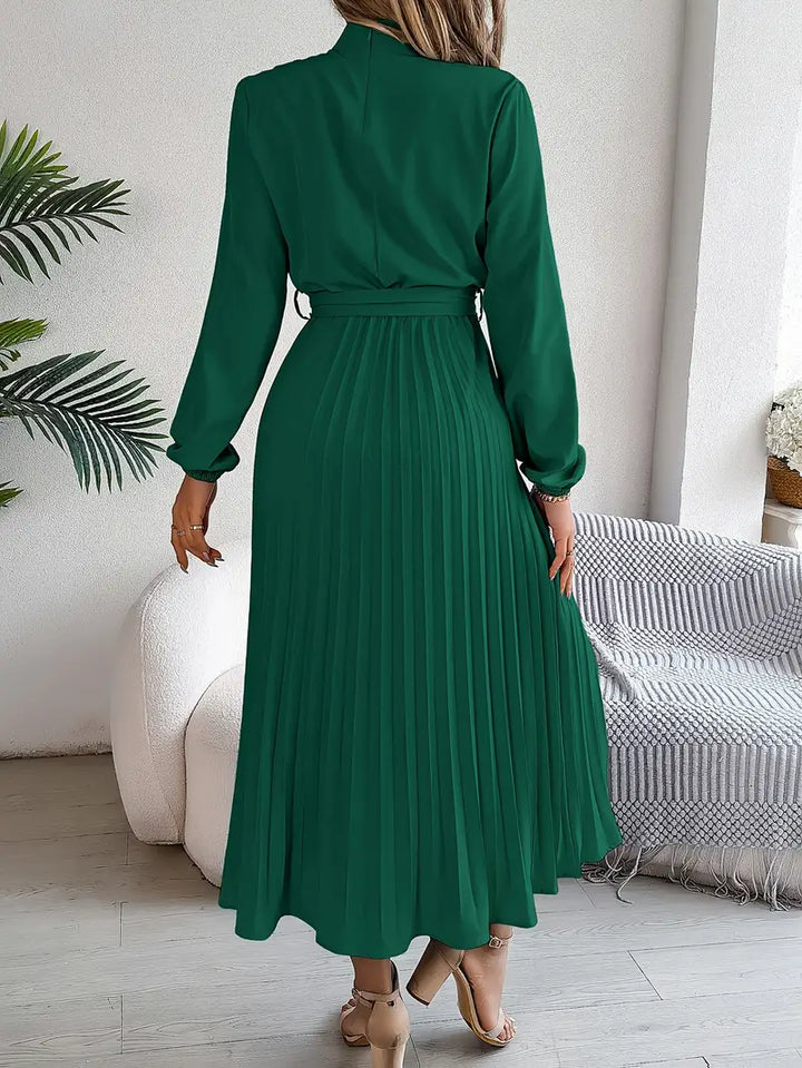 Versatile women's elegant midi dress, featuring graceful pleats and a stylish belted waist.