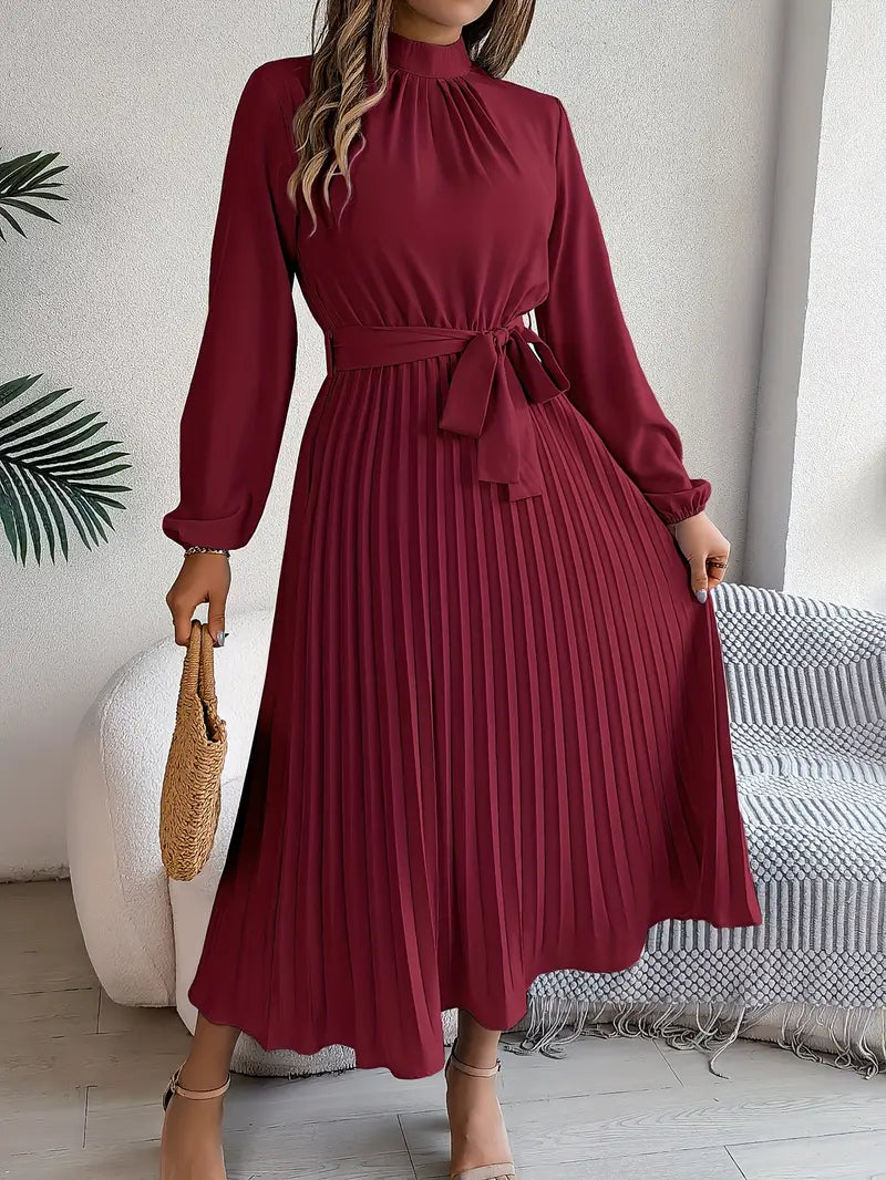 Stylish long-sleeve women's midi dress with an elegant belted design and flowing pleats.