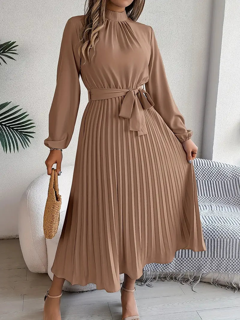 Classic women's elegant midi dress, combining long sleeves, pleats, and a sophisticated belt.
