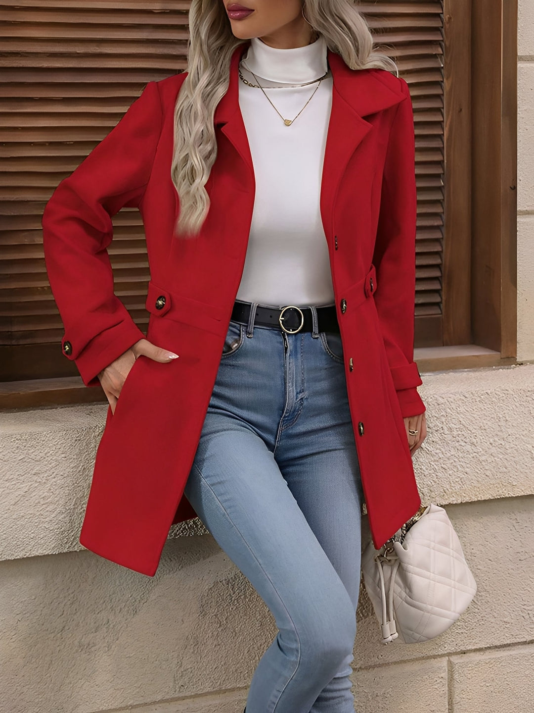 Versatile women's trench coat, perfect as transitional outerwear, featuring a classic notch collar & belt.