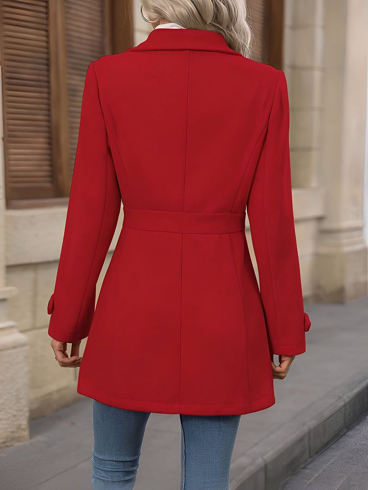Elegant women's office wear: a belted, double-breasted trench coat with a refined notch collar.