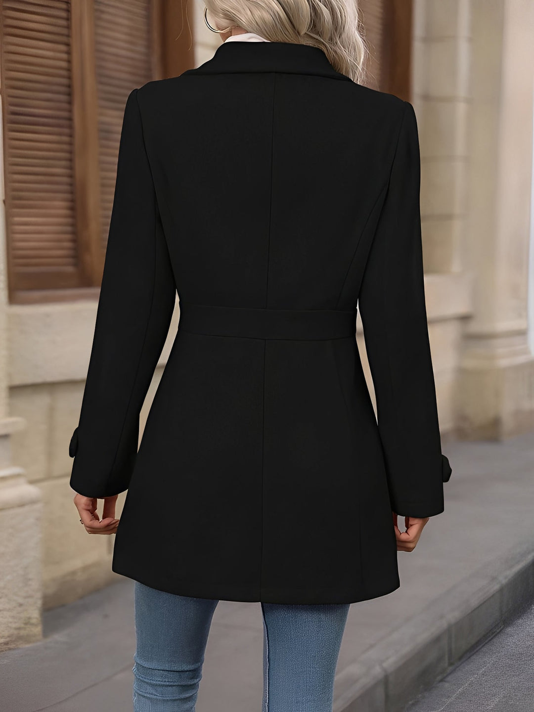 Front view of a women's timeless trench coat, showcasing its elegant notch collar and waist belt.