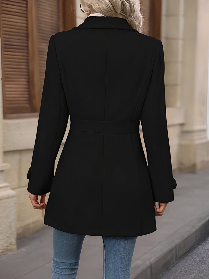 Front view of a women's timeless trench coat, showcasing its elegant notch collar and waist belt.