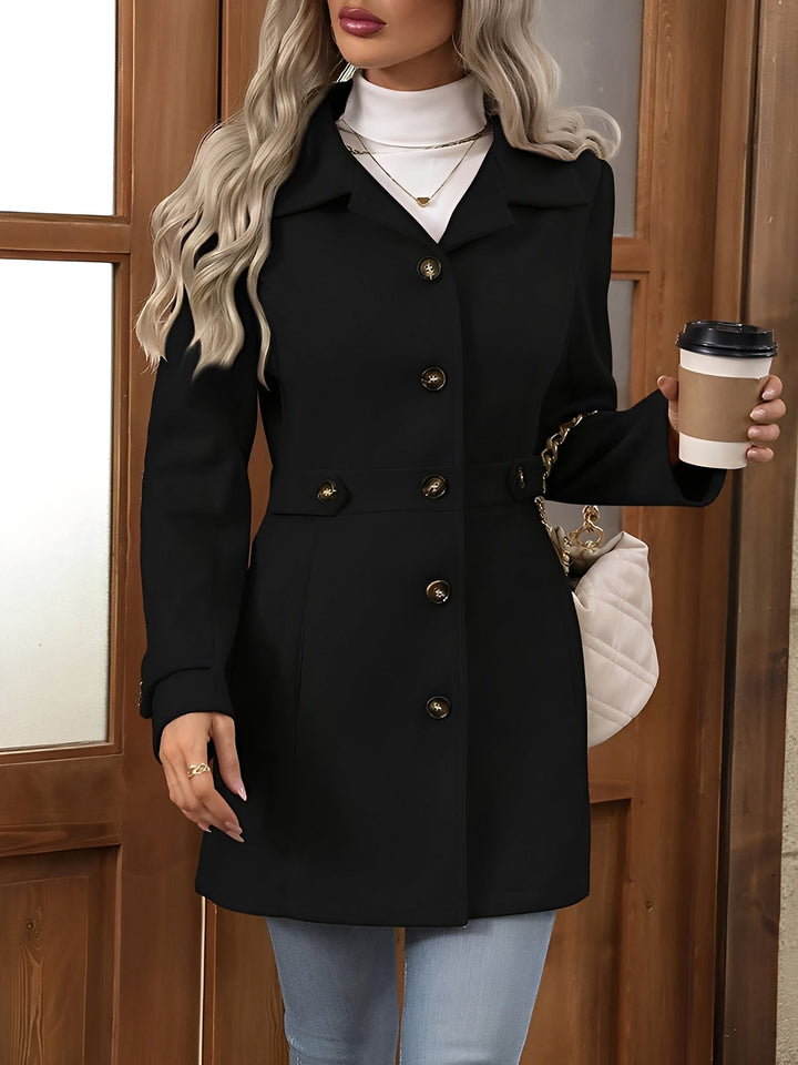 Women's elegant long trench coat with a distinct notch collar and a figure-flattering belt.