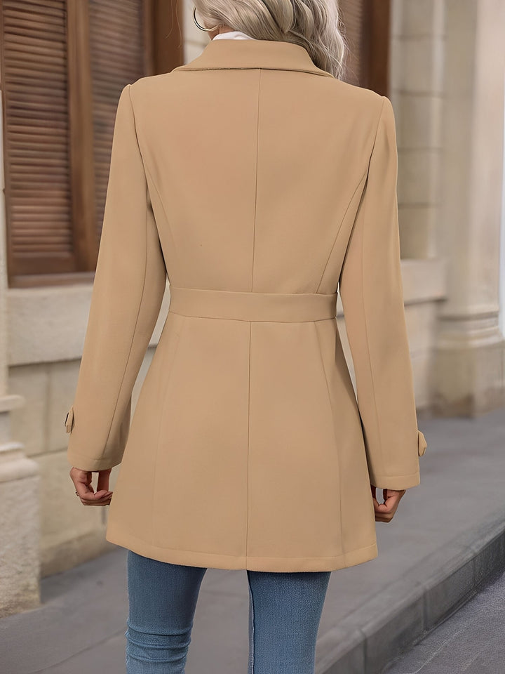 Classic double-breasted trench coat for women, featuring a stylish notch collar & adjustable belt.
