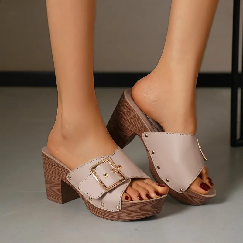 Modern women's fashion sandals: versatile buckle block heel slides in a sleek finish.