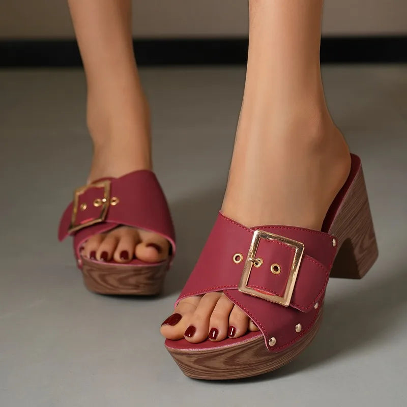 Fashionable women's elegant footwear: buckle block heel slides for versatile dressing.