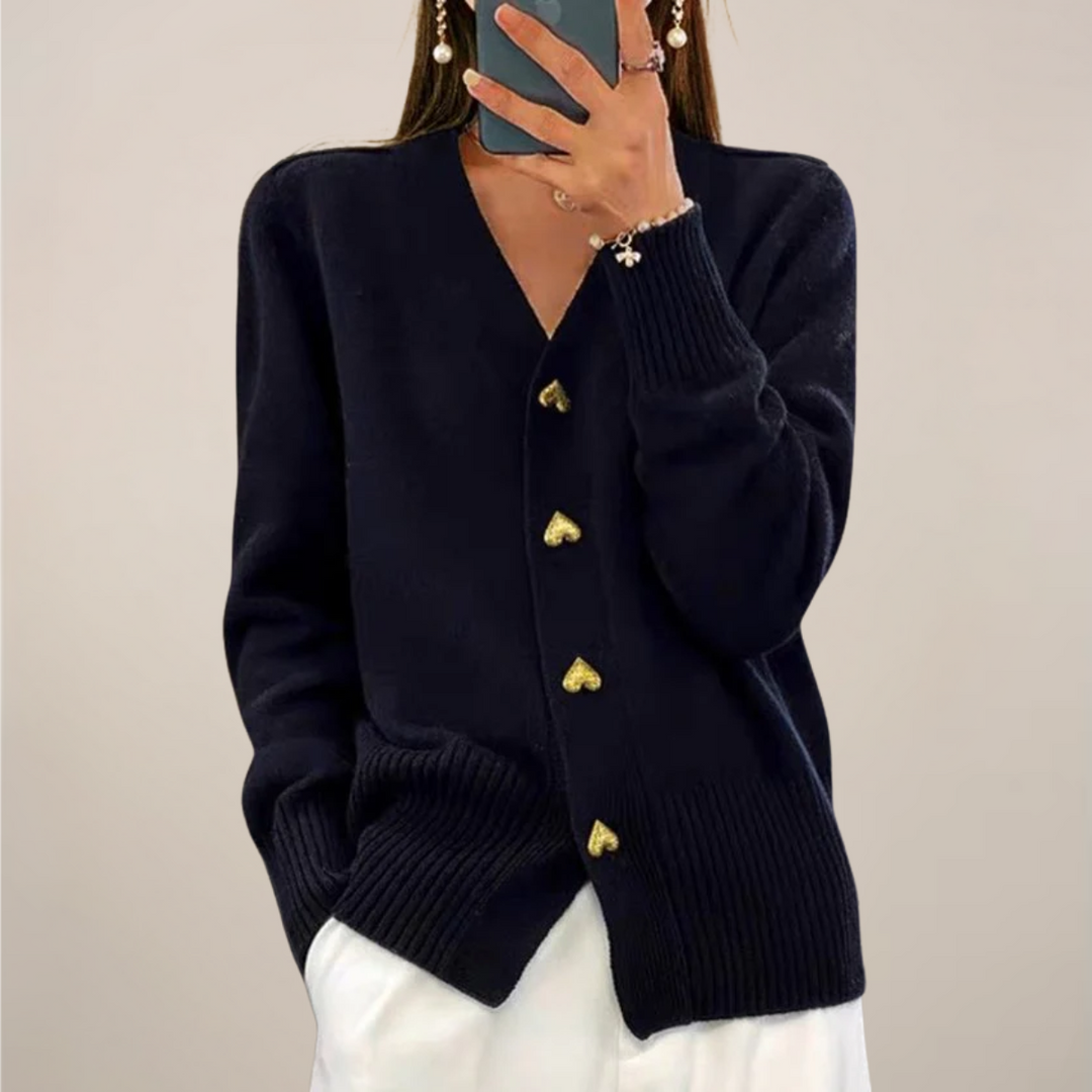 Elegant women's black cardigan with unique gold heart buttons. Long sleeve, relaxed fit, perfect for versatile layering.