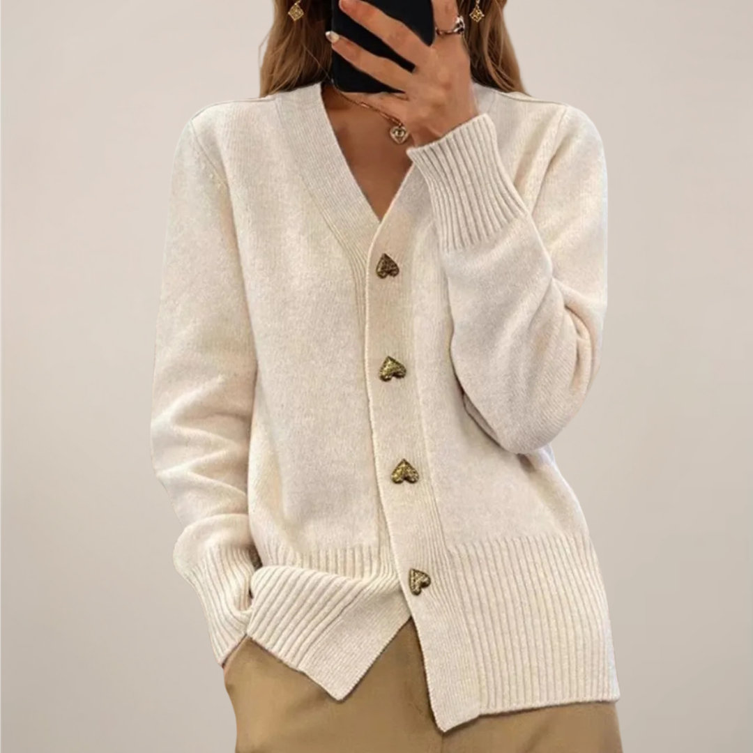 Chic beige women's cardigan with graceful drape & gold heart buttons. A versatile, elegant top for any occasion.