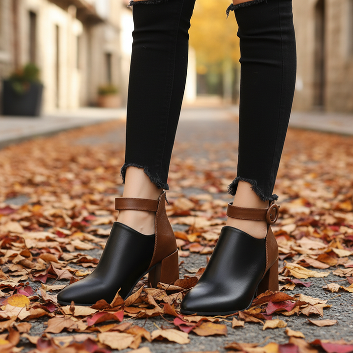 Elegant women's black faux leather ankle boots with block heel, perfect for autumn fashion.
