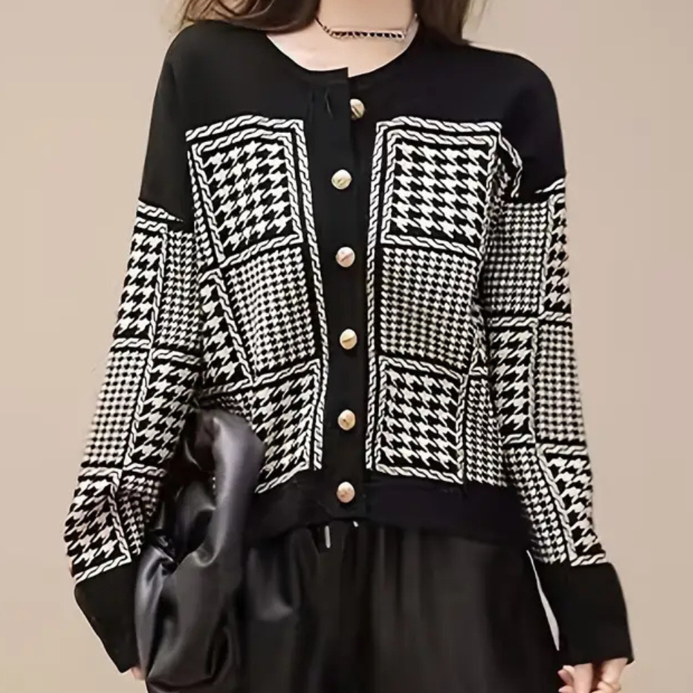 Elegant women's black houndstooth cardigan. Classic long-sleeve layering piece for autumn & winter fashion.
