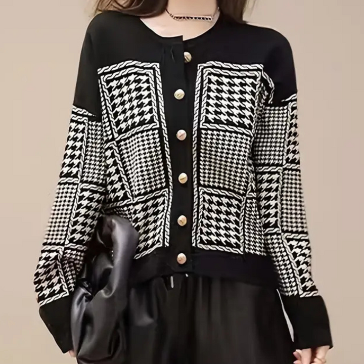 Elegant women's black houndstooth cardigan. Classic long-sleeve layering piece for autumn & winter fashion.