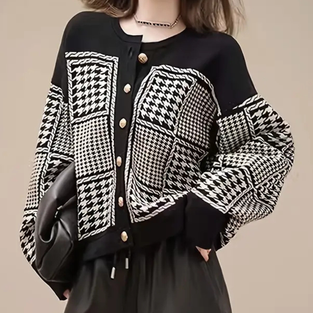 Classic black houndstooth cardigan for women. Elegant long-sleeve layering piece for chic autumn & winter style.