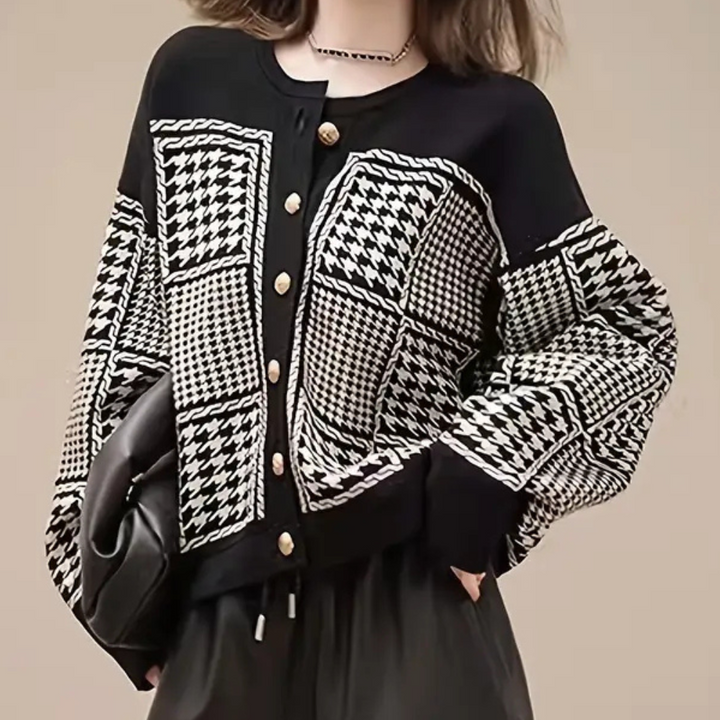 Classic black houndstooth cardigan for women. Elegant long-sleeve layering piece for chic autumn & winter style.