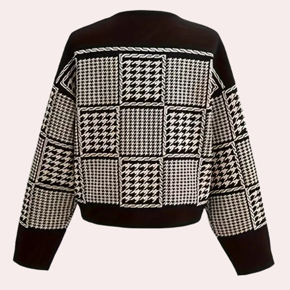 Women's elegant black houndstooth cardigan. Timeless, versatile top perfect for a stylish autumn or winter outfit.