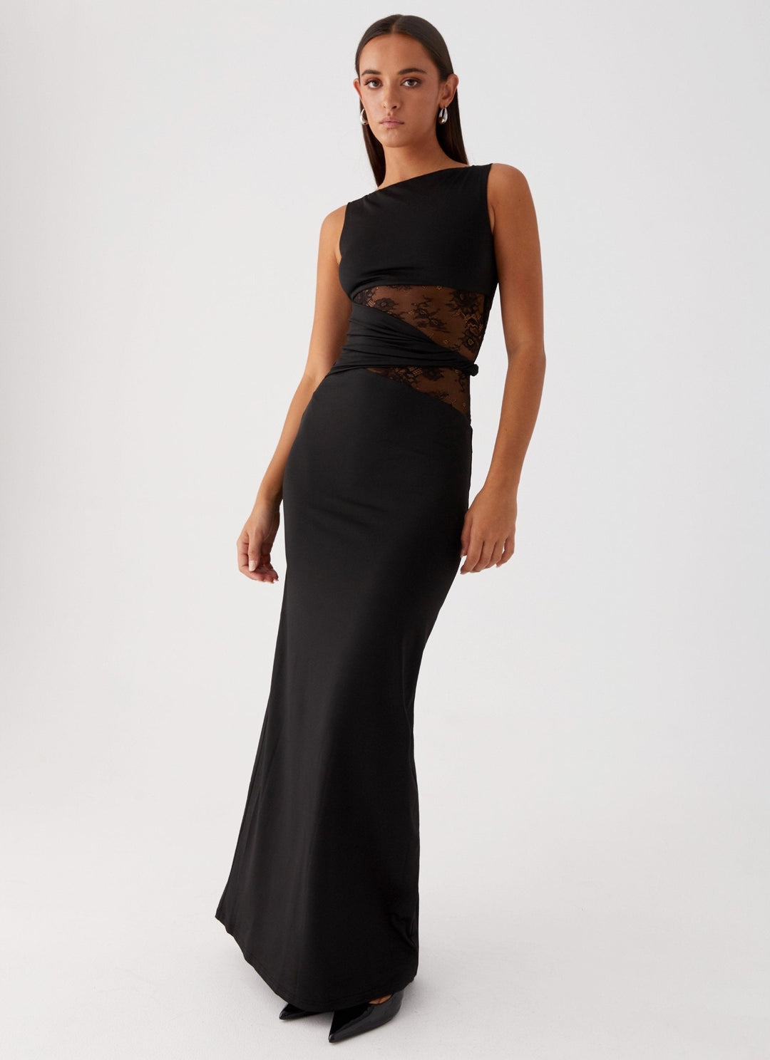 Sleeveless black lace cut out formal maxi dress with elegant boat neck, suitable for evening gowns.