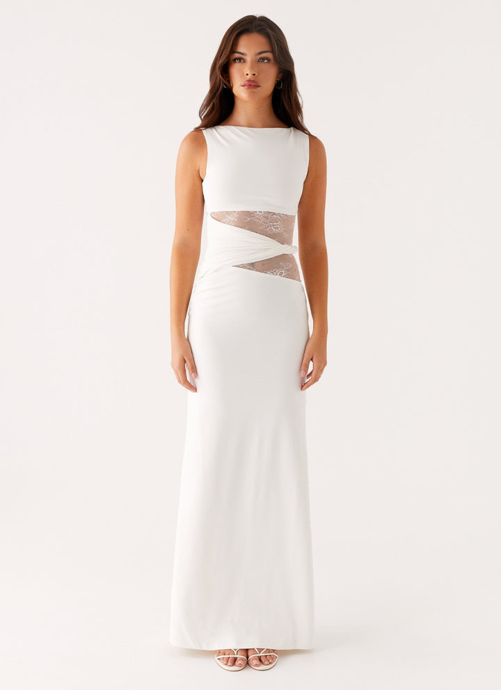 Beautiful white lace cut out boat neck maxi dress for women, perfect as an elegant formal evening gown.