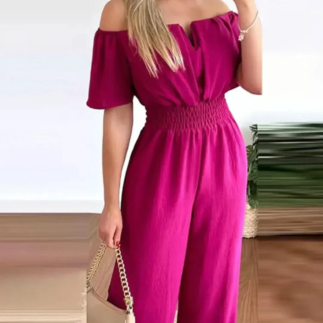 Stylish women's off-shoulder jumpsuit with short sleeves, featuring an elastic waist for comfort.