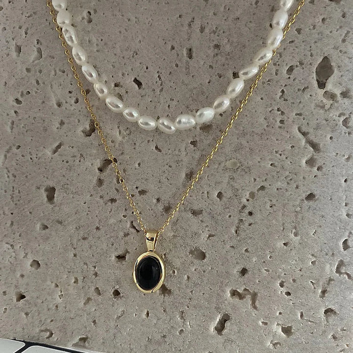 Two-piece layered necklace set for women, featuring elegant black onyx and lustrous pearls.