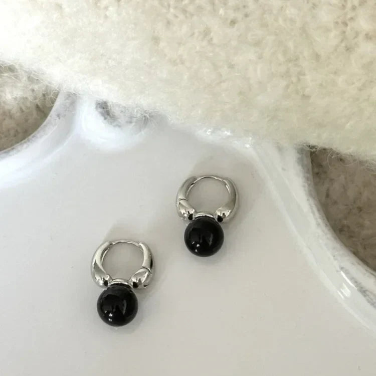 Elegant women's black onyx stud earrings, natural gemstone jewelry with a classic style, perfect fashion accessory.
