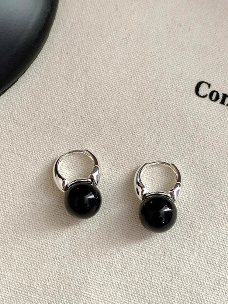 Classic black onyx stud earrings for women, elegant natural gemstone jewelry, a timeless fashion accessory.