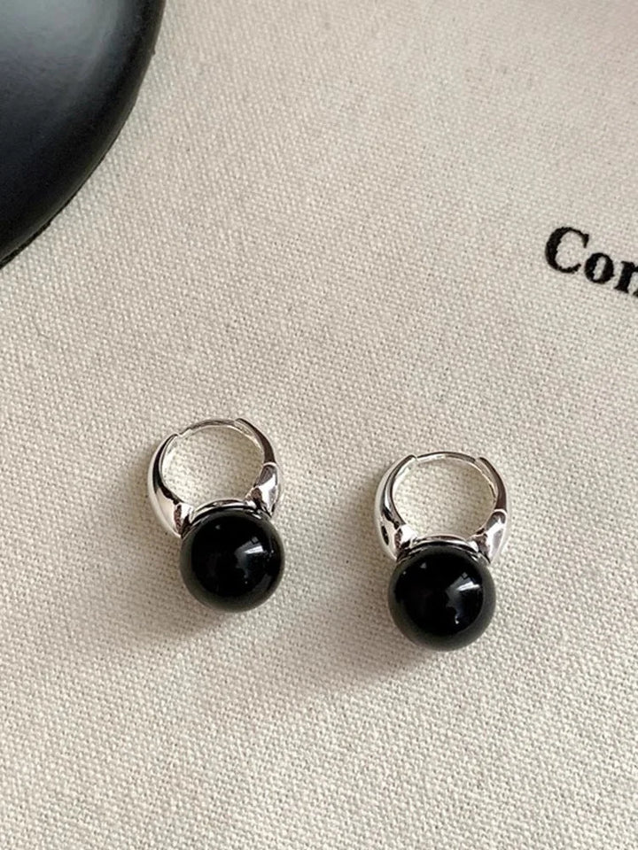 Classic black onyx stud earrings for women, elegant natural gemstone jewelry, a timeless fashion accessory.