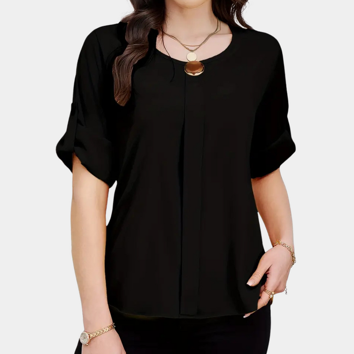 Women's airy black pleated blouse, a stylish long-sleeve top for elegant office wear or chic everyday fashion. Loose and comfortable.